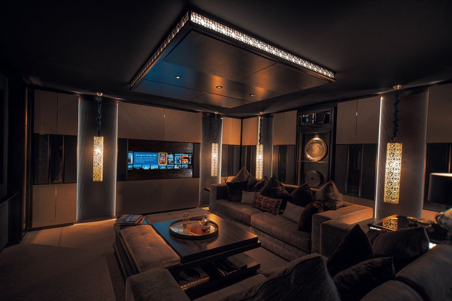 A living area with a TV appearing behind paneling.